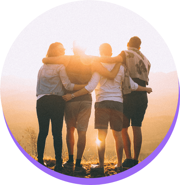 4 adults looking at sunrise